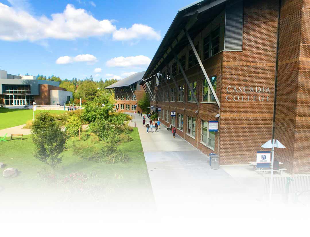 Large brick campus buildings and green lawns